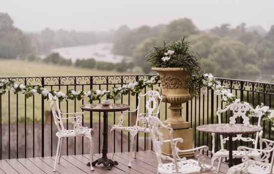 River-Room-Flowers-on-terrace-with-view-behind